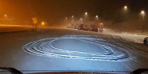 Trucking at Night in the Rockies With a Light Trailer During a Snow Storm