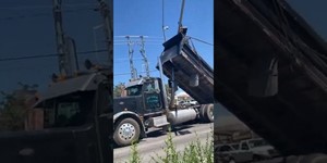Semi Truck Gets Stuck on Traffic Light Pole